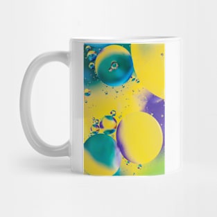 Colorful close up of oil drops in water Mug